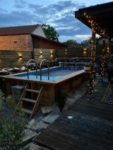 a swimming pool with two faucets on top of it at La grange in Promilhanes