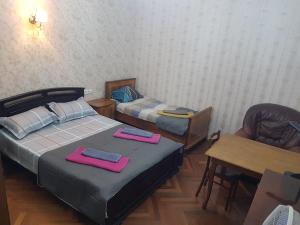 Postel nebo postele na pokoji v ubytování Romson Hotel