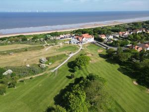 an aerial view of a house and the ocean at North Shore Hotel in Skegness