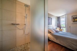 Posteľ alebo postele v izbe v ubytovaní Gîte Le Jorat - Studio