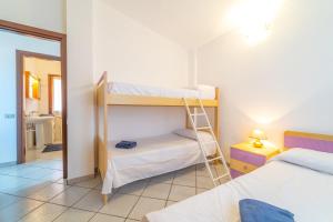 En eller flere senge i et værelse på Myosotis Terrace by DomusAway