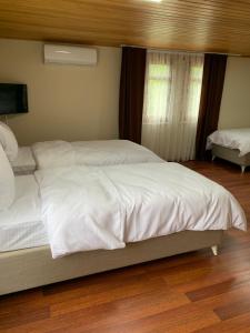 Postel nebo postele na pokoji v ubytování esa suite