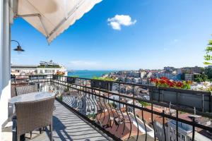 a balcony with a table and chairs and the ocean at Juno Hotel Taksim in Istanbul