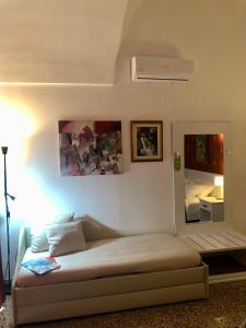 Postel nebo postele na pokoji v ubytování B&B dai Mimmi