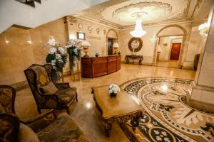 a lobby with a reception desk in a building at Continental Hotel in Ulaanbaatar