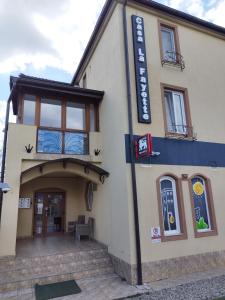 a building with a sign on the front of it at Casa La Fayette in Timişoara