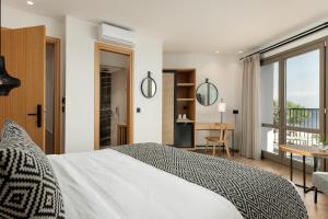 Postel nebo postele na pokoji v ubytování Hotel Ideon