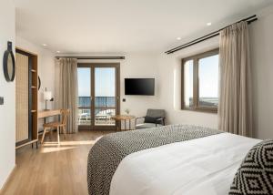 Postel nebo postele na pokoji v ubytování Hotel Ideon