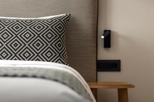 Postel nebo postele na pokoji v ubytování Hotel Ideon