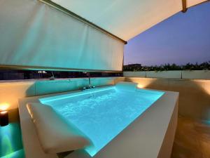 The swimming pool at or close to Le Suite con terrazzo Abitare Roma