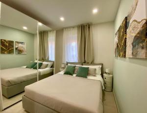 A bed or beds in a room at Le Suite con terrazzo Abitare Roma