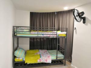 a room with three bunk beds in a room at Condo with great view in PJ in Petaling Jaya