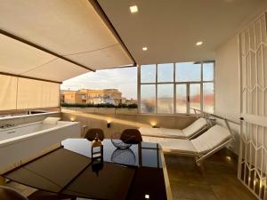 A seating area at Le Suite con terrazzo Abitare Roma