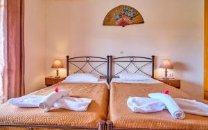 Postel nebo postele na pokoji v ubytování Hotel Olga