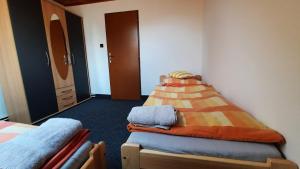 Postel nebo postele na pokoji v ubytování Penzion U Statku