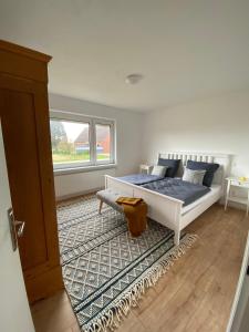 Postel nebo postele na pokoji v ubytování Landhaus Grootheide