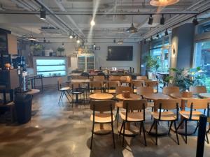 a restaurant with tables and chairs in a room at STAY7 Myeongdong in Seoul