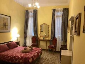 a bedroom with a bed with a teddy bear on it at VENEZIA NATURALMENTE ideale per gruppi e famiglie in Venice