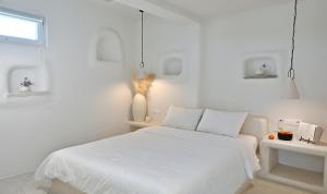 Postel nebo postele na pokoji v ubytování VLIA Mykonos