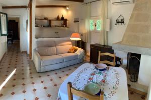 a living room with a white couch and a table at Villa Giulia in Lecce