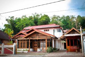 a house with a red roof at Bamboosa in Bukittinggi