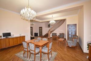 a dining room with a table and chairs at Homestay at City Center in Yerevan