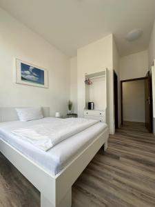 Postel nebo postele na pokoji v ubytování Hotel Astor
