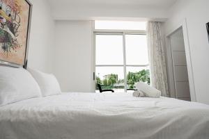 Postel nebo postele na pokoji v ubytování Golf Residence Sea and Soul + 12 fotografií