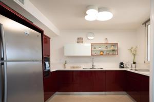Kuchyň nebo kuchyňský kout v ubytování Golf Residence Sea and Soul