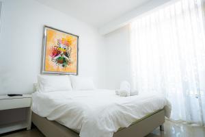 Postel nebo postele na pokoji v ubytování Golf Residence Sea and Soul