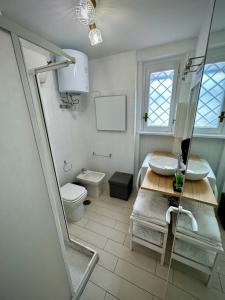 a bathroom with a sink and a toilet at La Roma di Camilla in Rome