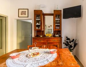 a wooden table with two bowls of food on it at La Semplicità del Borgo in Bagnoregio