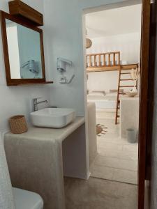 a bathroom with a sink and a mirror at BLUE IN NAXOS in Naxos Chora