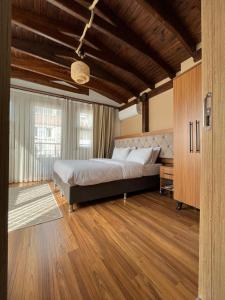 A bed or beds in a room at PALMERA ART HOUSE