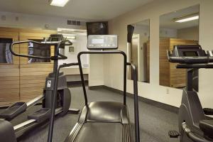 a gym with several treadmills and a treadmill at Ramada by Wyndham Sterling in Sterling