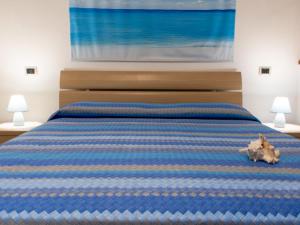 Giường trong phòng chung tại Sogni di Mare