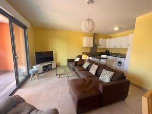a living room with two couches and a tv at Appartement Fréjus, 3 pièces, 4 personnes - FR-1-226A-290 in Fréjus