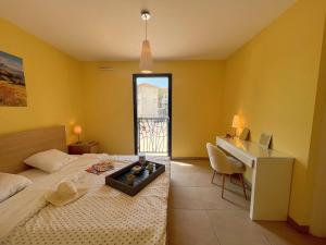 a hotel room with a bed and a desk and a desk at Appartement Fréjus, 3 pièces, 4 personnes - FR-1-226A-290 in Fréjus