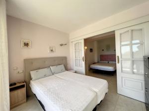 Posteľ alebo postele v izbe v ubytovaní Isla de Roses 1-24