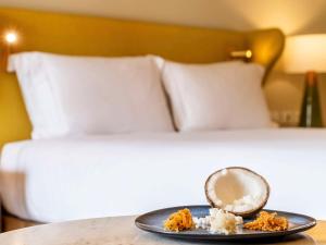 Cama ou camas em um quarto em Fairmont Rio de Janeiro Copacabana