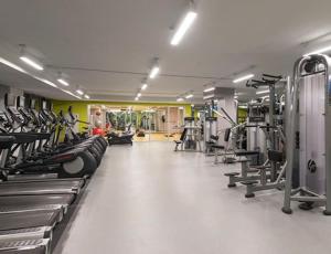 a gym with lots of treadmills and machines at 2 BR 1.5t Bath in Midtown West in New York