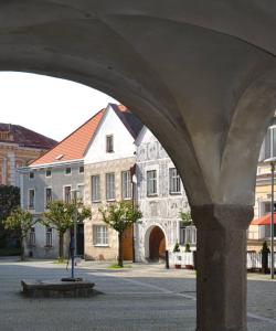 a view of a building from under a bridge at Slavonice Mázhaus in Slavonice