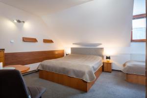 Postel nebo postele na pokoji v ubytování Vila Viktória