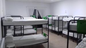 A bed or beds in a room at Albergue O Trisquel