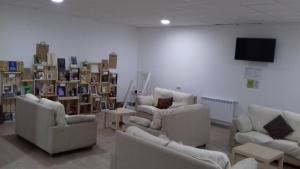 A seating area at Albergue O Trisquel