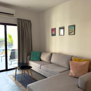a living room with a couch and a table at Zoi Ayia Napa in Ayia Napa