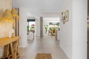 a hallway of a home with white walls at Casa Las Palmeras in Marbella