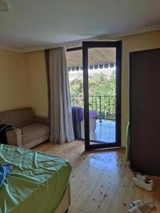 Ένα ή περισσότερα κρεβάτια σε δωμάτιο στο Valdi Guest Shekvetili
