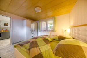 Postel nebo postele na pokoji v ubytování Ferienhaus Andrea