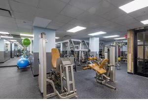 a gym with chairs and equipment in a room at Spectacular Fully Furnished 2 BR 2 Bath in Upper East Side in New York